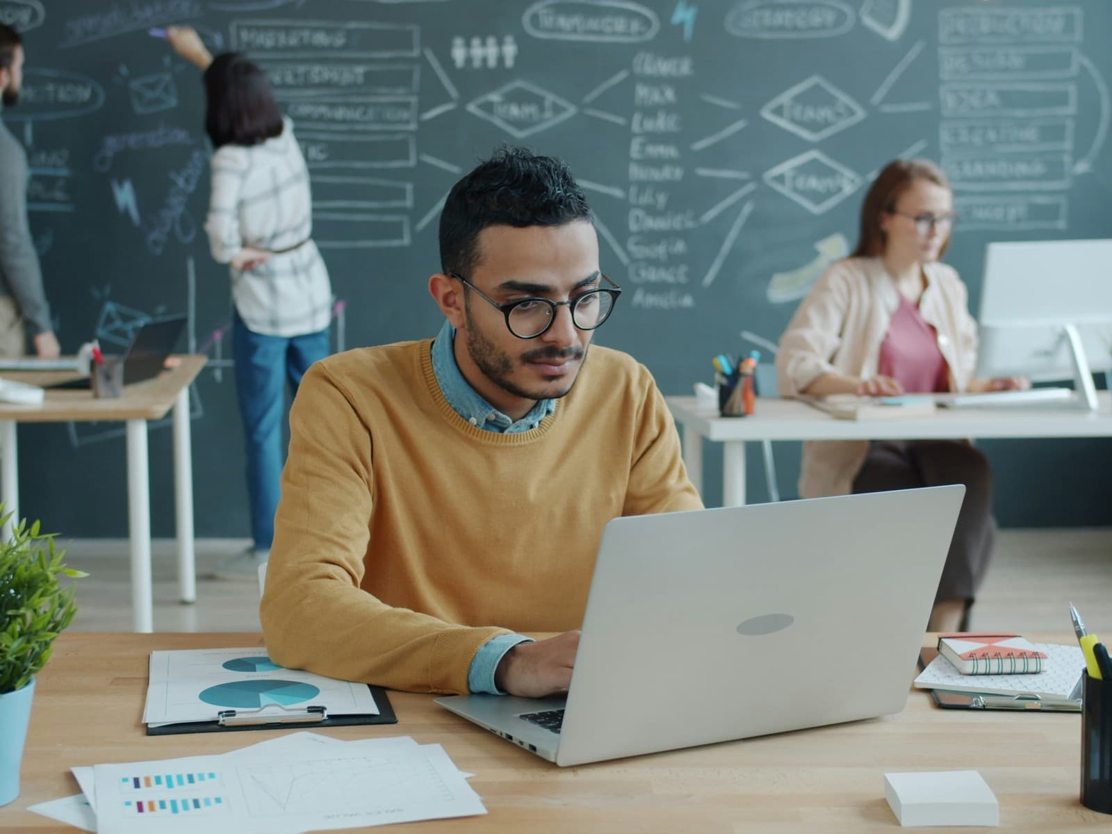 Software team collaborating in a modern office